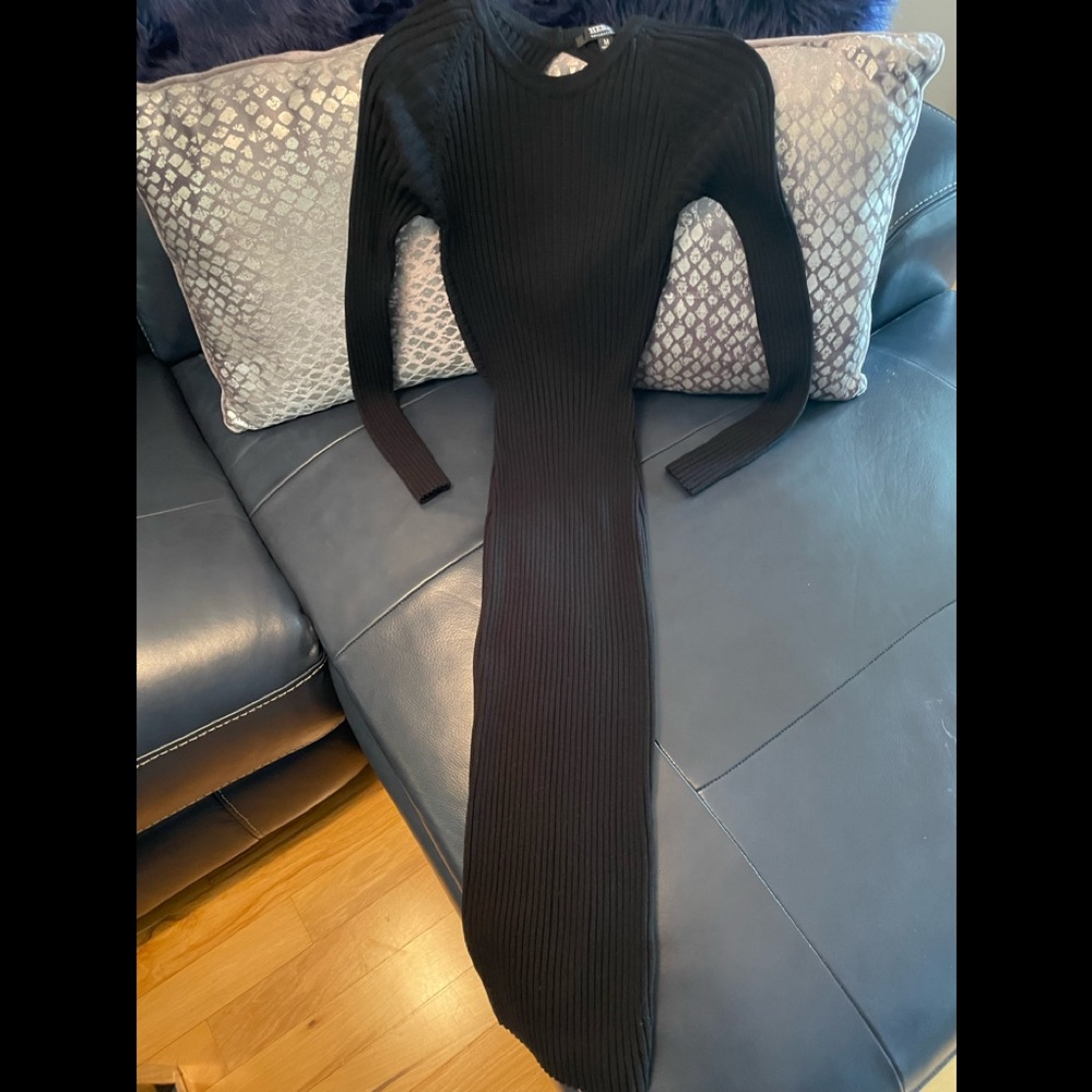 Beautiful! Classy! Openback, black bodycon dress. Fit for any occasion.